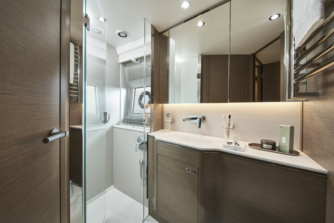 v55-interior-forward-cabin-bathroom-silver-oak-satin