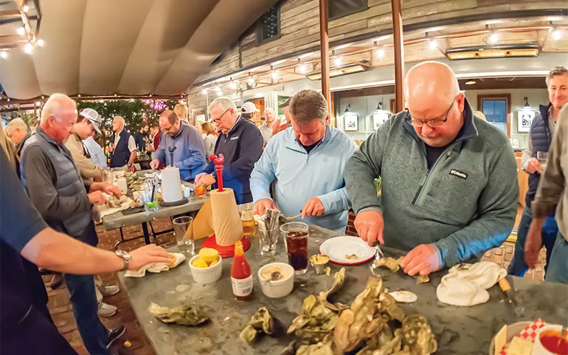 Bluewater team members enjoy a meal at their annual meeting