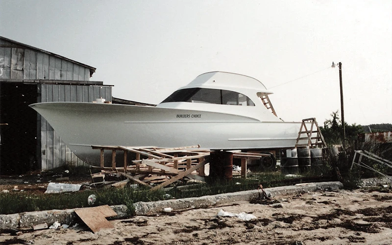 The first Jarrett Bay boat, 'Builder’s Choice,' under construction at the original yard, highlighting the early stages of craftsmanship