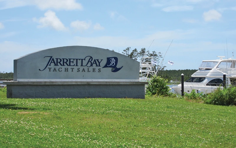 Jarrett Bay Yacht Sales sign at their facility, representing the growth and expansion of the company into yacht brokerage