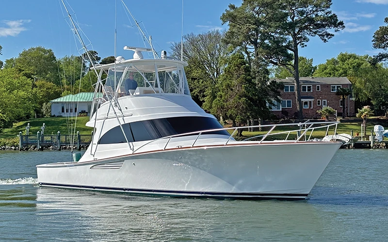 Bow view of the Viking 46 Billfish cruising through calm waters, demonstrating its impressive design and performance