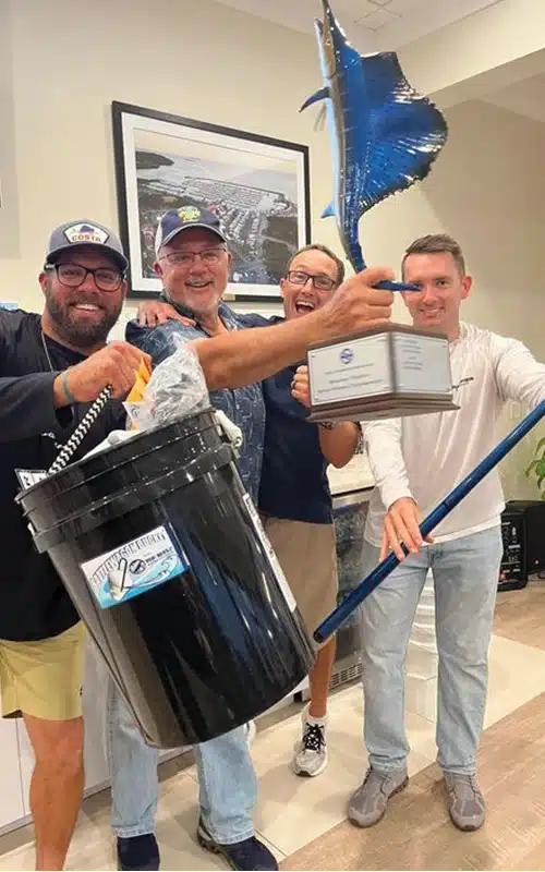 Fishing tournament prize-winners celebrating at Safe Harbor Old Port Cove